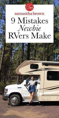 a woman sitting in the driver's seat of a camper parked next to trees