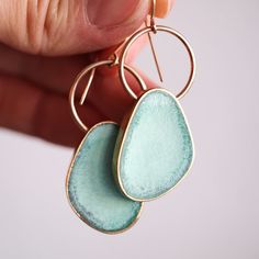 New statement earrings for when you want something both classic and down-to-earth. This style is meant to be more organic in shape, with our classic circle set style of earring. Giving it a bit of a hoop earring look, but with a little something extra. Pair with the Circle Necklace or simply layer with other gold or turquoise necklace pieces you already own. Here's us announcing their global launch in our mini blog. The total length of this earring is right around 2 inches from ear lobe dangle p Oval Single Earring For Everyday, Unique Everyday Brass Earrings, Unique Teardrop Hoop Earrings For Everyday, Hand Forged Brass Circle Earrings, Unique Brass Earrings For Everyday Wear, Modern Hand Forged Drop Earrings, Modern Handmade Jewelry For Everyday, Unique Small Hoop Single Earring, Unique Dangle Hoop Earrings For Everyday