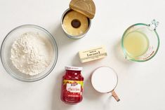 ingredients to make cake sitting on top of a table