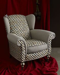 a chair sitting on top of a red cloth covered floor