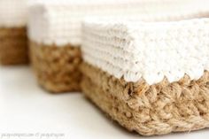 two crocheted baskets sitting side by side on top of a white countertop