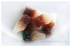 small pieces of sugared fruit on a white plate