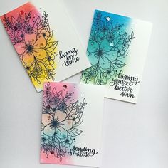 three cards with watercolor flowers on them