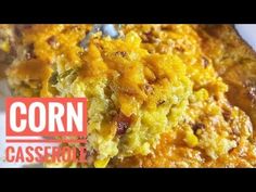 corn casserole on a white plate with a fork in it and the words corn casserole