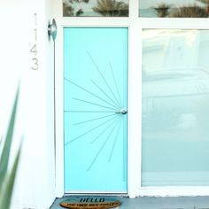 a blue front door with the word hell on it and an arrow in the center