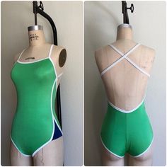 Vintage 70s green one-piece swimsuit.  Garment and elastic is in great condition. Made in USA Fits a size extra small-small, see measurements below.  -M E A S U R E M E N T S- Bust: 26" - 36" w/ open back Waist: 24" - 36" Hips: 30" - 38" Length (shoulder to crotch): 29" - 35" 💌 Note that this items price includes shipping *Please note that all items are previously loved and may show signs of wear. Any major wear to the pieces will be noted. *due to the nature of our business we do not offer exc Green Stretch One-piece Bodysuit, Green Stretch Bodysuit For Poolside, Green Fitted Bodysuit For Swimming, Green Fitted One-piece Bodysuit, Fitted Green One-piece Bodysuit, Retro Green Stretch Swimwear, Green Stretch Bodysuit For Beach, Green Stretch Bodysuit For The Beach, Fitted Green Bodysuit For Beachwear