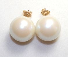 Old Stock 16 MM Large  Made in  1900's In Spain White  Round Pearl Stud Earrings in 14k Gold Filled. This listing is for a pair of Beautiful High quality 14 MM  White  Pearl Studs. These Coated High Quality  are originally made  in  Spain. Expect some minor scraches ( Not Visible) Due to Age. These are old probably around 1900 coated pearls. Please understand that I pair them carefully and consider to accept minor discoloration due to age of these pearls.  High luster and narc Majorca  pearls ar Formal Cream Pearl Earrings, White Victorian Earrings For Formal Occasions, Victorian Style White Earrings For Formal Occasions, White Victorian Round Earrings, Victorian White Round Earrings, Victorian Style White Round Earrings, Victorian White Pearl Earrings For Formal Occasions, Majorca, Pearl Stud Earrings