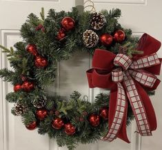 a christmas wreath with red and green ornaments