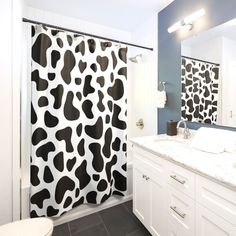 a black and white shower curtain in a bathroom