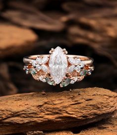 a close up of a ring on top of a rock