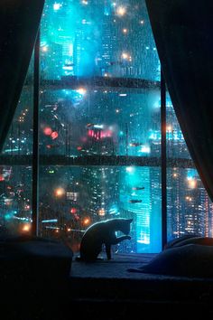 an umbrella sitting on top of a bed in front of a window with city lights