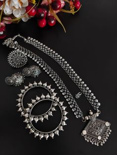 This minimalistic long oxidized necklace set is perfect for an Indian bride. Beautifully designed with German oxidized silver, this wedding set has a big intricate long Haram oxidized necklace, a pair of jhumki earrings, a ring, a pair of bangles, and a nose pin. This bridal oxidized set is available in six different patterns and sizes. Each of these pieces will work wonderfully on its own and even more elegant when worn together. You can also style them with your Navratri outfit or any ethnic o Long Oxidised Necklace, Chandbali Oxidized Wedding Jewelry Sets, Wedding Chandbali Jewelry Sets With Oxidized Finish, Wedding Chandbali Oxidized Jewelry Sets, Antique Silver Oxidized Wedding Jewelry, Temple Jewelry Sets With Oxidized Finish For Wedding, Festive Oxidized Finish Bridal Necklace, Festive Oxidized Bridal Necklace, Fusion Style Oxidized Wedding Jewelry