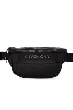 Find GIVENCHY G-trek Bum Bag on Editorialist. Givenchy G-trek Bum Bag in Black Technical fabric. Made in Italy. One main compartment. Front grosgrain strap with tonal logo detail. Adjustable tonal GIVENCHY shoulder strap. Measures approx 10 W x 4 H x 3 D Shoulder strap with a 8 drop. GIVE-MY249. BKU040K1RG001. About the designer: Hubert de Givenchy founded his namesake fashion house specializing in Haute Couture and ready-to-wear in 1952. No sooner did it open than Givenchy earned a reputation for breaking with the fashion codes of its time. Today, the house is synonymous with aristocratic elegance, sensuality and fresh romanticism. Its legacy continues through the modern approach of its newest Creative Director Matthew M. Williams, appointed in June 2020. Luxury Travel Belt Bag With Logo, Designer Travel Belt Bag With Zipper Closure, Designer Belt Bag With Zipper Closure For Travel, Designer Belt Bag For Travel With Zipper, Black Logo Bags For Outdoor, Luxury Bags For Outdoor Activities, Luxury Belt Bag With Zipper Pocket For Travel, Nylon Bags With Logo For Outdoor Activities, Outdoor Nylon Bags With Logo