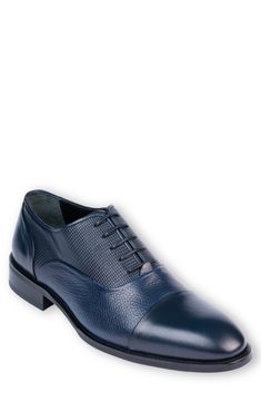 Elevate your wardrobe with a contemporary oxford constructed from smooth and textured leather in a sophisticated cap-toe silhouette. Lace-up style Leather upper and lining/synthetic sole Made in Turkey Blue Cap Toe Oxfords With Leather Lining, Blue Cap Toe Oxfords For Office, Blue Business Oxfords, Blue Cap Toe Dress Shoes, Classic Blue Dress Shoes For Work, Blue Dress Shoes For Work, Blue Cap Toe Oxfords For Derby, Blue Goodyear Welted Oxfords For Work, Classic Blue Oxfords For Derby