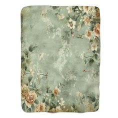 an image of a bed with flowers on the comforter and pillow cases in mint green