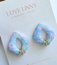 Add a little pop of color to your every day attire with these pink and blue marbled earrings!  Each pair is handmade, so color and pattern could vary slightly. Artsy Blue Polymer Clay Earrings, Trendy Handmade Pastel Earrings, Trendy Pastel Earrings For Gift, Cute Blue Resin Earrings, Blue Artsy Resin Earrings, Artsy Blue Resin Earrings, Cute Blue Polymer Clay Jewelry, Cute Blue Polymer Clay Earrings, Pink Polymer Clay Earrings