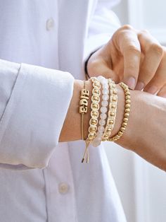 Upgrade your wrist stack with our Katie Bracelet, a beige pull tie bracelet adorned with elegant gold pisa beads. Simple and effortlessly, this bracelet adds a touch of sophistication to your everyday look. Wear it solo or alongside other satisfying neutrals. This bracelet features 5mm gold ball beads. Adjustable Gold Stretch Bracelet For Everyday, Adjustable Matte Gold Minimalist Bracelet, Elegant Adjustable Bracelets With Letter Beads, Everyday Beige Bracelet Jewelry, Elegant Adjustable Beige Beaded Bracelets, Elegant Everyday Cream Bracelets, Trendy Beige Bracelets For Everyday, Trendy Everyday Beige Bracelets, Trendy Everyday Beige Bracelet