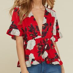 This Beautiful Red Blouse Features Ruffled Sleeves And A Plunging V Neck Neckline. Pair It With A Lacey Bralette Or Rock It Bare. This Is Perfect For A Daytime Stroll Or Night On The Town. S, M, L Order Your True Size. Summer V-neck Blouse For Date Night, Summer Floral Print Top For Date Night, Floral Print Top For Date Night In Summer, Floral Print V-neck Top For Date Night, Floral Print Tops For Summer Date Night, Spring V-neck Flirty Blouse, Chic Red Blouse For Brunch, Red Summer Blouse For Brunch, Floral Print V-neck Blouse For Date Night