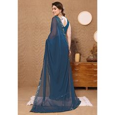 Teal Blue colored saree is prettified with beautiful embroidered butti work as shown which makes it appear classy. This saree is made of georgette fabric which is accompanied with banglori silk blouse piece which you can customise as per your design/style. Women can buy this saree to wear for their party and functions. Note:- The actual product may differ slightly in color and design from the one illustrated in the images when compared with computer or mobile screen Measurements: Saree : Georget Blue Georgette Pre-draped Saree With Pallu, Blue Anarkali Style Pre-draped Floor-length Saree, Blue Anarkali Style Pre-draped Georgette Saree, Festive Blue Georgette Pre-draped Saree, Blue Georgette Pre-draped Saree With Self Design, Blue Anarkali Chinon Pre-draped Saree, Blue Unstitched Saree With Sheer Dupatta, Georgette Saree With Self Design, Blue Anarkali Floor-length Blouse Piece