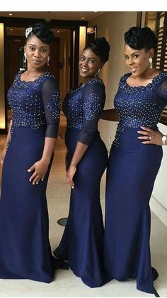 three women in blue dresses posing for the camera with their hands on their hipss