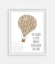 an image of a hot air balloon with the words she leaves a little sparkle everywhere