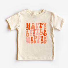 We are loving the fun boho styles that are coming back these days. And is there anything cuter than a little boy or girl sporting this happy little hippie t-shirt! Super soft, polyblend fabric (100% cotton upon request). We use Bella Canvas for most of our shirts. We love the groovy colors and flowers in this shirt. Comes in baby sizes, toddler sizes and youth sizes. Happy Little Hippie Toddler/Baby Shirt, cute kids shirt, trendy, retro toddler, gift, peace, groovy Playful Tops With Funny Print For Playtime, Funny Print Tops For Spring Playtime, Funny Print T-shirt For Spring Playtime, Playful Summer T-shirt For Playdate, Casual Printed T-shirt For Playtime, Casual Printed T-shirt For Play, Casual Tops With Custom Print For Playtime, Playful Funny Print T-shirt For Playtime, Playful T-shirt With Funny Print For Playtime