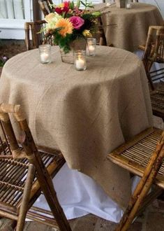 the table is set with candles and flowers