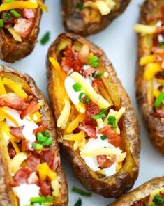 loaded baked potatoes with cheese and bacon on top are ready to be eaten for lunch