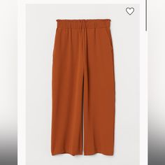 Pull On-Pants In Woven Fabric. High Waist, Wide, Elasticized Waistband With Narrow Ruffle Trim At Top, And Side Pockets. Straight, Wide, Ankle-Length Legs. Burnt Orange, Wide-Leg, Pull On Pants New With Tags H&m Relaxed Fit Bottoms For Workwear, H&m Straight Pants For Summer, H&m Summer Straight Pants, H&m Bottoms With Elastic Waistband For Summer, H&m Wide-leg Pants For Workwear, H&m Wide-leg Workwear Pants, H&m Straight Summer Pants, H&m Bottoms With Elastic Waistband For Spring, H&m Wide-leg Workwear Bottoms