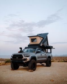 a truck with a camper attached to it's bed