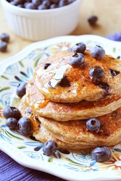 stack of pancakes with blueberries on a plate