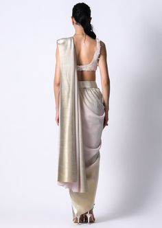 Our midnight sari made in our pleated metallic with an ombre foil detail is perfect for your upcoming festivities. Lightweight and easy to wear, it is pre-draped with an attached petticoat. Pair it with the riri blouse that is hand embroidered with transparent sequins. It has a square neckline and closes on the side with a zipper. Perfect outfit for those fun boho day weddings. Ruffle Saree, Drape Saree, Square Necklines, Pink Cotton, Petticoat, Aza Fashion, Perfect Outfit, Hand Embroidered, Blouses For Women