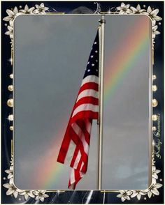 an american flag flying in front of a rainbow