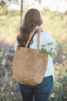 *Made-to-order* Mustard Large Classic Tote The Classic Tote is the original Glory Leather Co. tote. The idea was to create a bag that was minimal, practical, gorgeous and made to fit any occasion, and I think we have accomplished just that. The simplicity of the Classic Tote only adds to its beauty and uniqueness. From traveling, to date night, class, to mom life, this tote will perform perfectly and last you for years to come.  Glory Leather Co. totes are all hand-stitched and made from full-gr Handmade Leather Bags For Errands, Vegetable Tanned Leather Bag With Leather Handles As Gift, Natural Leather Bags As Gifts, Natural Leather Bags For Gifts, Natural Leather Bags For Gift, Classic Vegetable Tanned Leather Tote Bag, Tan Textured Leather Tote Bag, Yellow Soft Leather Tote Bag, Suede Tote Bag With Gold-tone Hardware