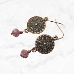 Add a touch of boho chic to your outfit with these stunning copper mandala earrings. Handcrafted with care, these earrings feature a beautiful mandala design, symbolizing harmony and balance. The elegant berry pink Czech glass bead dangle adds a pop of color and motion, making these earrings perfect for any occasion.  Hypoallergenic ear wires (nickel and lead free). Choose ear wire style at checkout.  A gift for you or someone special, earrings are carded and in an organza bag. Link to my shop: Bohemian Pink Wire Wrapped Beaded Earrings, Pink Bohemian Jewelry With Ear Wire, Bohemian Pink Jewelry With Ear Wire, Pink Teardrop Jewelry For Festivals, Bohemian Pink Jewelry With Dangling Beads, Pink Nickel-free Bohemian Jewelry, Bohemian Nickel-free Pink Jewelry, Handmade Spiritual Pink Earrings, Handmade Pink Spiritual Earrings