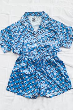 Our luxuriously soft Evil Eye Pajamas are perfect for weddings, bridal parties, holidays, getaways, bachelorette weekends, vacations, or just lounging at home. Features a button front shirt and elastic waist bottoms. Shorts feature hidden pockets. These pajamas are in production and require 5-6 weeks before shipment. Satin Lounging Set For Summer, Summer Satin Lounging Set, Casual Satin Sleep Sets, Summer Sleepwear With Elastic Waistband, Relaxed Fit Satin Sleepwear For Loungewear, Relaxed Fit Satin Sleepwear For Bedtime, Blue Satin Pajama Party Set, Blue Sleepwear With Elastic Waistband For Relaxation, Blue Sleepwear With Elastic Waistband For Bedtime