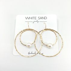 White Edison Pearl Hoop within a Hoop Earrings. PLEASE NOTE: The Edison pearls will vary in shape, size and color and will have natural occurring birthmarks. The pearls will range and measure from 9mm to 11mm. These are stock photos, the earrings you receive will be similar but different. NOTE: This listing is for ONE pair of earrings only. All White Sand Jewelry comes in a hand stamped gift box ready for gifting. PROCESSING TIME: Each piece is handcrafted and made-to-order, specifically for you White Pearl Small Hoop Earrings With Ear Wire, Pearl White Hoop Pearl Earrings, White Pearl Hypoallergenic Hoop Earrings, Pearl White Hoop Earrings, Handmade White Pearl Hoop Earrings, Sand Jewelry, Marquise Earrings, Hippie Rings, Edison Pearls