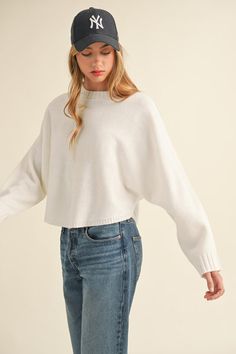 Stay stylish and cozy in our Dolman Sleeve Cape Style Sweater. With a round neck and cape style dolman sleeves, this knit top offers both comfort and fashion. Wrap yourself in warmth without sacrificing style. Cape Style, Style Sweater, New Tops, Dolman Sleeve, Denim Dress, Knit Top, Cape, Round Neck, Active Wear