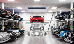 a garage filled with lots of different colored cars