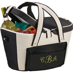 a black and white cooler bag with monogrammed wine bottles in the bottom compartment