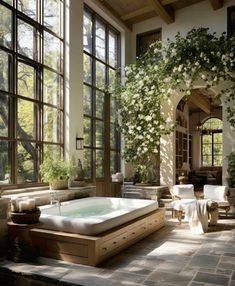 an indoor jacuzzi tub in the middle of a room with lots of windows