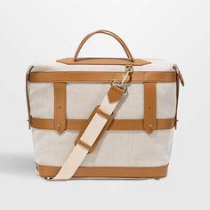 Paravel Scout Tan Weekender Bag | Crate & Barrel On-the-go Travel Bag With Leather Trim And Double Handle, Beige Luxury Weekender Bag, Luxury Satchel With Adjustable Strap For Weekend Trips, Rectangular Coated Canvas Duffle Bag For On-the-go, Classic Beige Weekender Bag With Double Handle, Luxury Beige Travel Bag With Leather Handles, Classic Beige Duffle Bag For Daily Use, Canvas Duffle Bag With Leather Trim For On-the-go, Rectangular Luggage With Detachable Strap For Weekend Trips