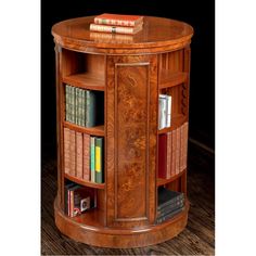 a book shelf with books on top of it and some other items in the corner