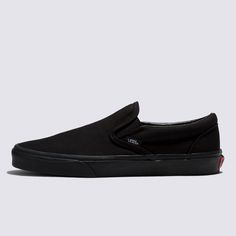 The Slip-On that’s been Setting Trends Since 1979All black everything. Vans #98 has been an integral part of the Vans line-up since its release in 1979, but these all-black Slip-On sneakers raise the style stakes to another level while keeping the focus on comfort and accessibility. The low-profile canvas uppers and supportive paddle collars make sure of that. The Classic Slip-On has come a long way since it first erupted on the scene, but the mix of comfort and style remains timeless. Iconic Sl Classic Slip-on Skate Shoes For Streetwear, Black Urban Vans Sneakers, Urban Black Vans Sneakers, Black Classic Sneakers With Vulcanized Sole, Black Casual Skate Shoes With Rubber Toe Cap, Casual Black Skate Shoes With Rubber Toe Cap, Classic Black Sneakers With Gum Sole, Vans Black Skate Shoes With Rubber Waffle Outsoles, Classic Black Skate Shoes With Branded Insole