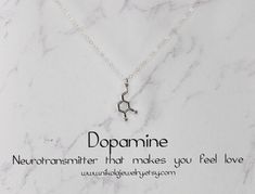 Small Silver Dopamine Molecule Necklace. I use the most gorgeous high-quality sparkly sterling silver chain which makes this necklace as one reviewer says "absolutely stunning." Keep this in mind when comparing similar products. Dopamine is a modern symbol of love and desire. Dopamine molecules interact with receptors in the brain to induce feelings of love, attention, and excitement. Dopamine also has an elegant shape. As a necklace, it is an attention-grabber. Perfect for the chemistry or biol Dna Ring, Chemistry Necklace, Dopamine Molecule, Biology Jewelry, Dna Jewelry, Molecule Necklace, Attention Grabber, Honeycomb Necklace, Geek Jewelry