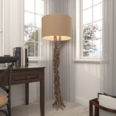 a room with a lamp, desk and chair