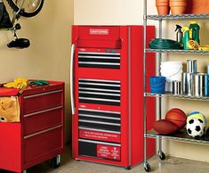 a red toolbox sitting on top of a metal shelf next to a basketball ball