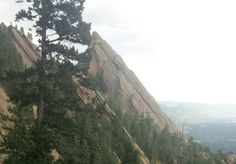 a group of people hiking up the side of a mountain