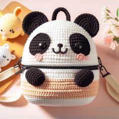 a panda bear purse sitting on top of a table