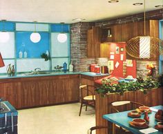 an old kitchen with blue counter tops and wooden cabinets, along with potted plants